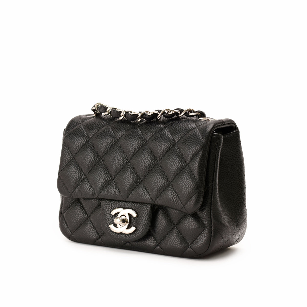 Black quilted caviar leather Chanel flap bag with silver chain strap, curated Pre-loved Luxury by Myluxe in Helsinki.