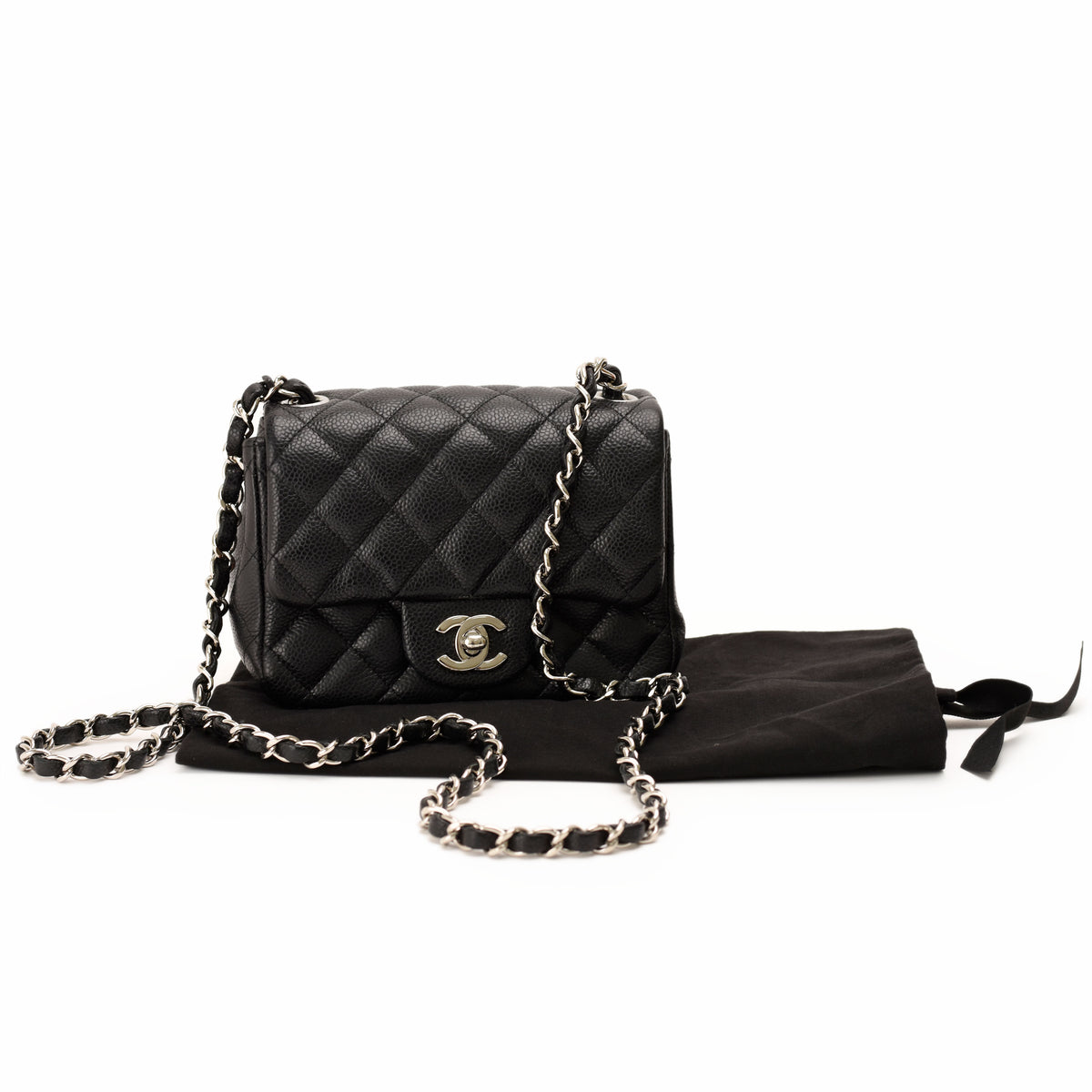 Black quilted caviar leather Chanel flap bag with silver chain strap, curated Pre-loved Luxury by Myluxe in Helsinki.