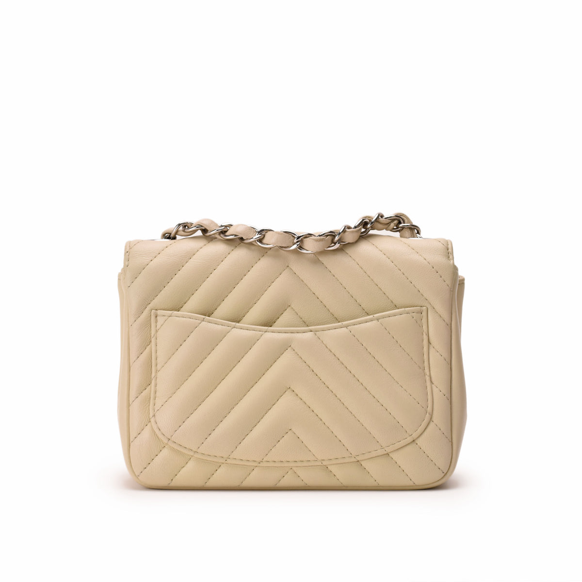 Beige quilted leather crossbody bag with silver chain strap, curated Pre-loved Luxury by Myluxe in Helsinki.