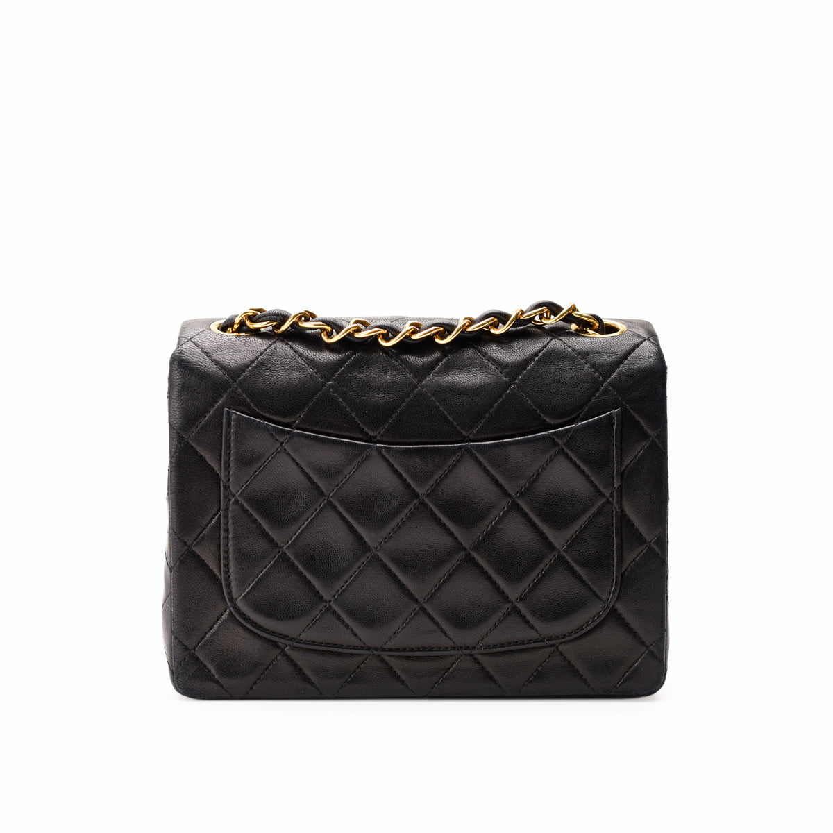 Black quilted lambskin leather handbag with gold-tone chain strap, curated Pre-loved Luxury by Myluxe in Helsinki.