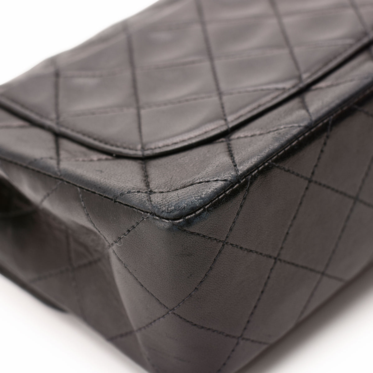 Black quilted leather designer handbag with diamond stitching, curated Pre-loved Luxury by Myluxe in Helsinki.