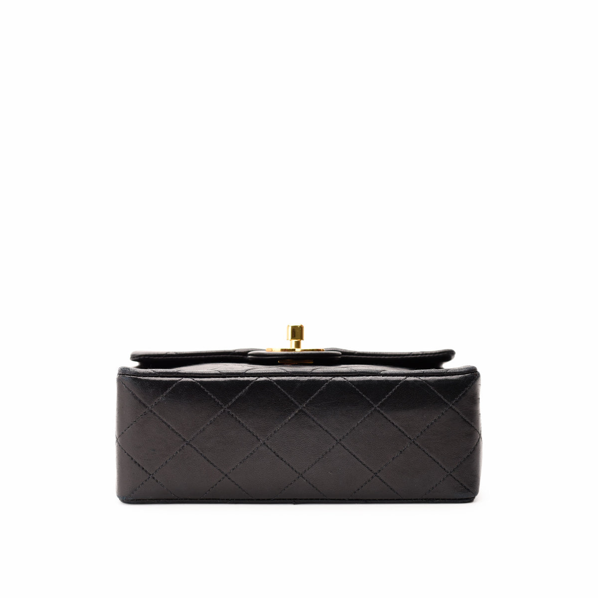 Black quilted leather clutch with gold-tone clasp, curated Pre-loved Luxury by Myluxe in Helsinki.