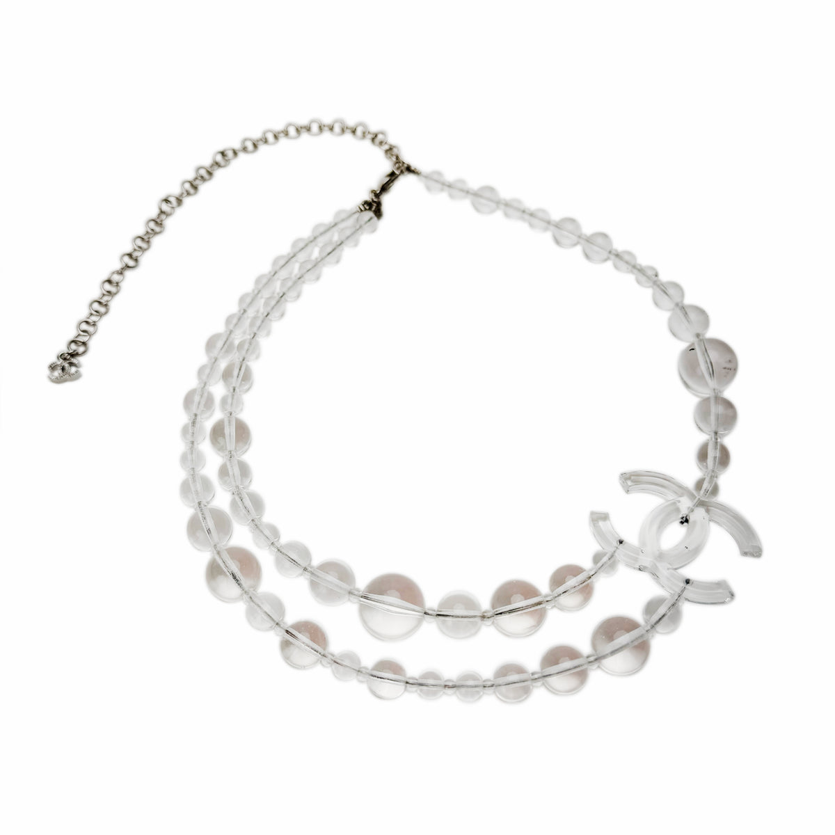 Clear transparent bead necklace with iconic interlocking CC charm, curated Pre-loved Luxury by Myluxe in Helsinki.