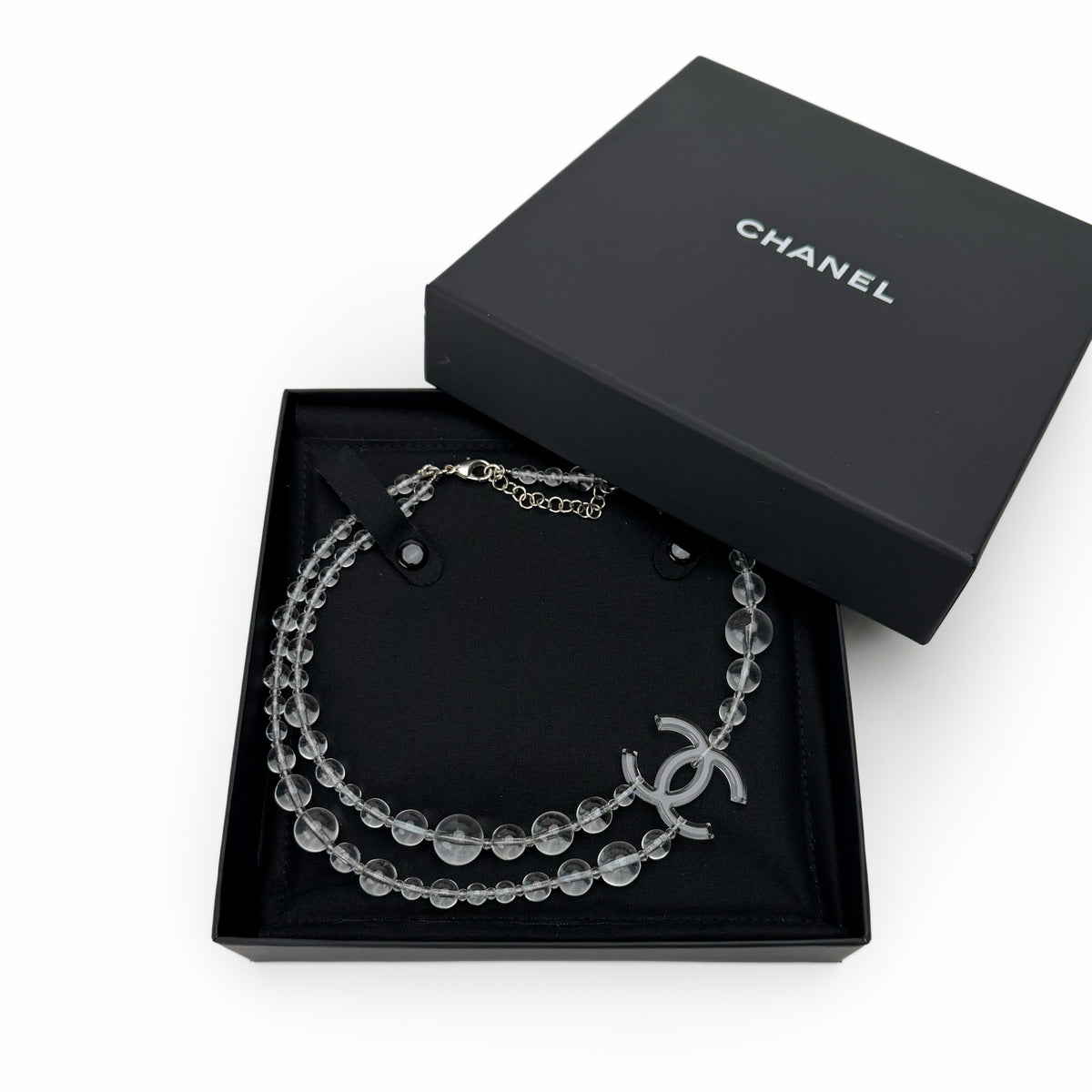 Chanel clear crystal bead necklace with silver-tone interlocking CC charm, curated Pre-loved Luxury by Myluxe in Helsinki.