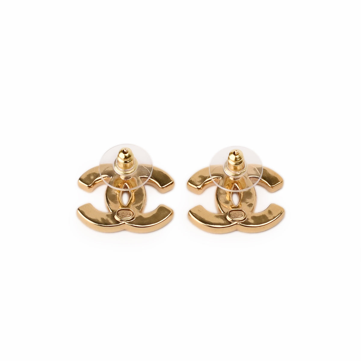 Gold-toned Chanel interlocking CC stud earrings, curated Pre-loved Luxury by Myluxe in Helsinki.