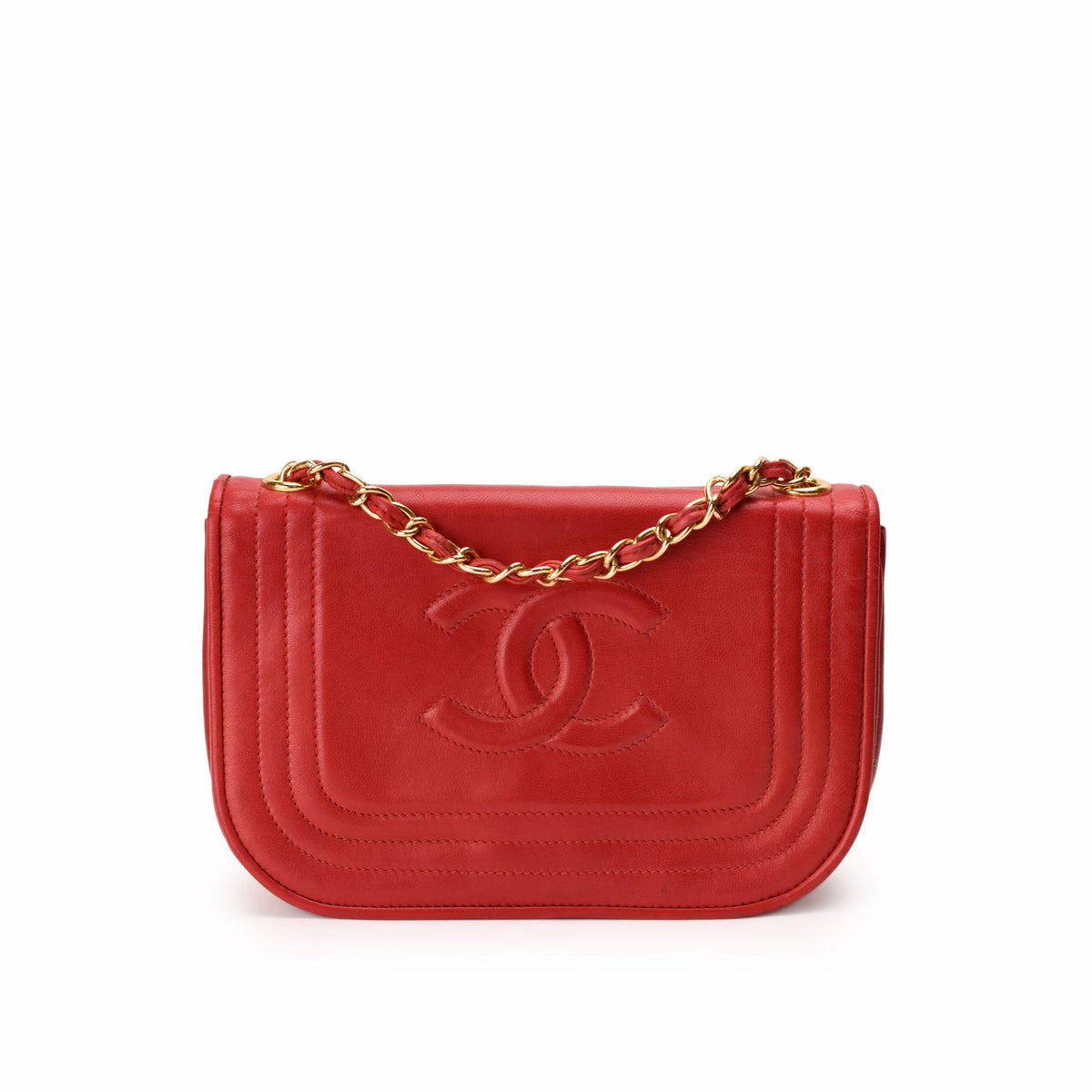 Red leather Chanel flap bag with gold chain strap, curated Pre-loved Luxury by Myluxe in Helsinki.