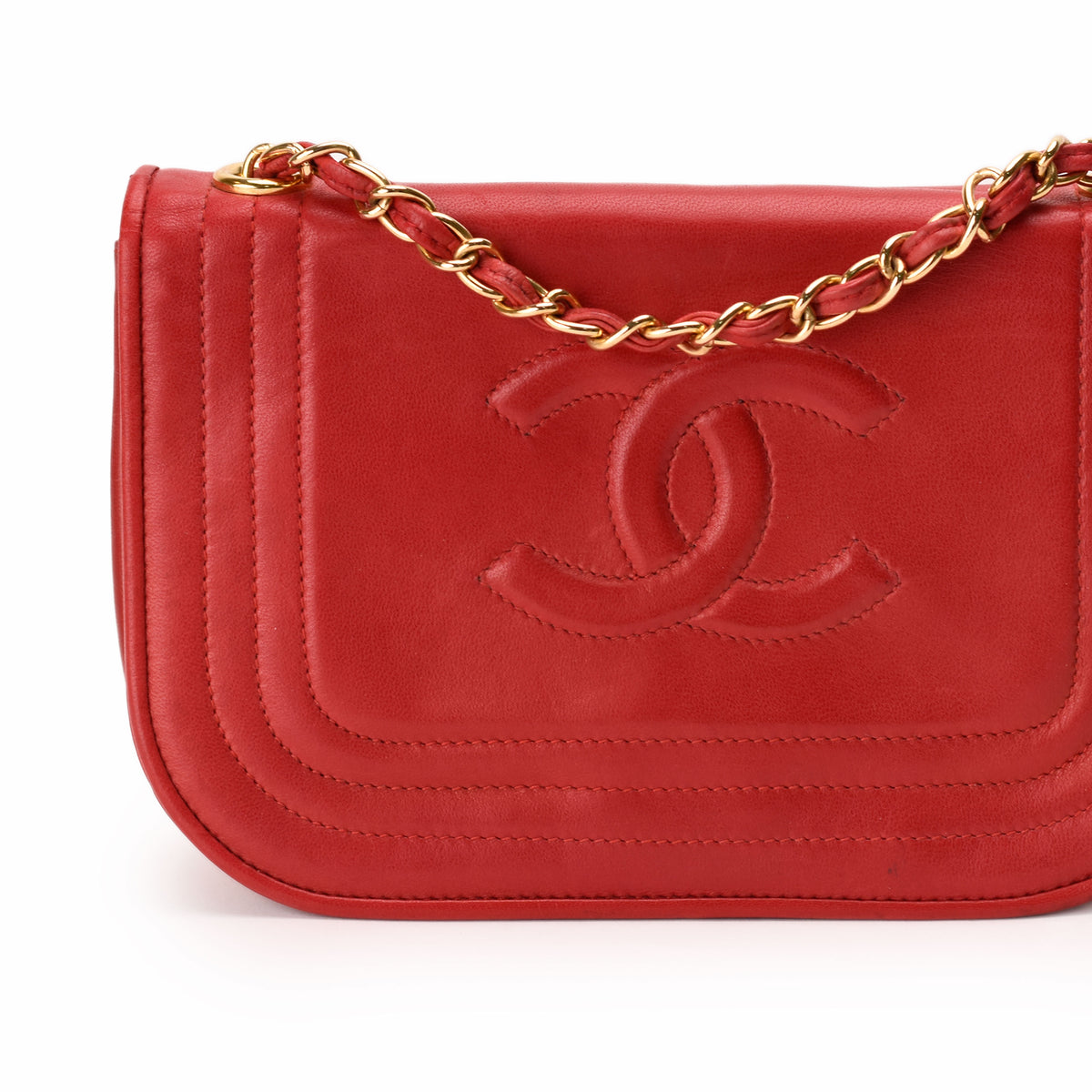 Red leather Chanel flap bag with gold chain strap, curated Pre-loved Luxury by Myluxe in Helsinki.