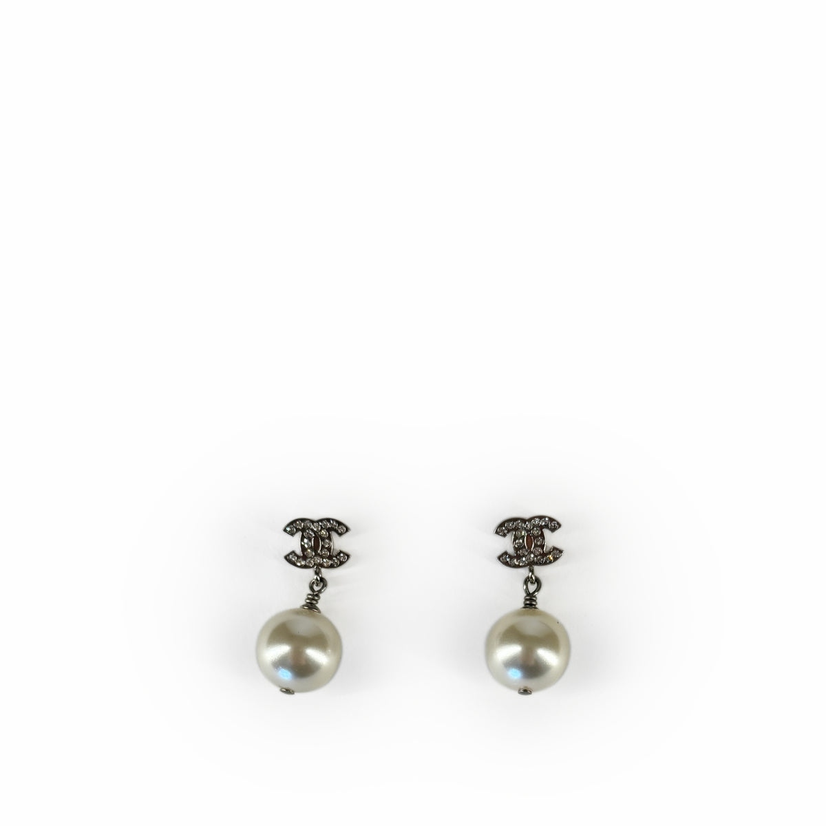 Chanel pearl drop earrings with silver-tone logo detail, curated Pre-loved Luxury by Myluxe in Helsinki.