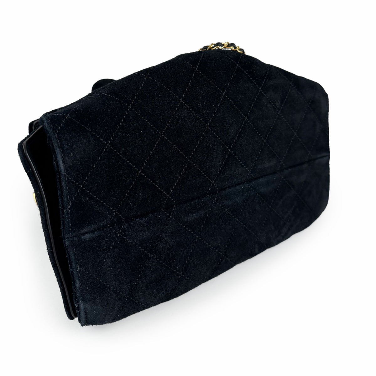 Black quilted suede designer handbag with gold chain strap, curated Pre-loved Luxury by Myluxe in Helsinki.