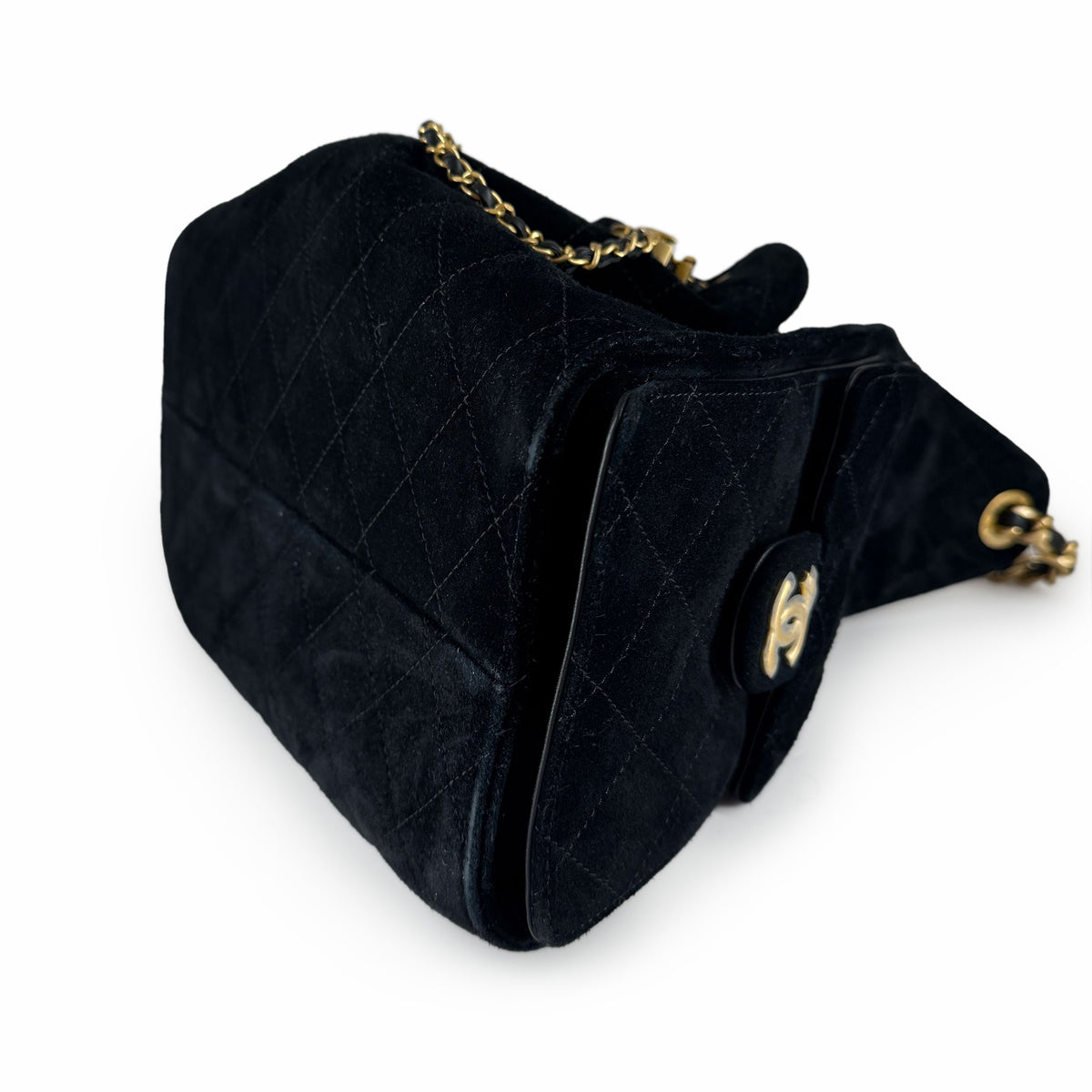 Black suede quilted flap bag with gold-tone chain strap, curated Pre-loved Luxury by Myluxe in Helsinki.