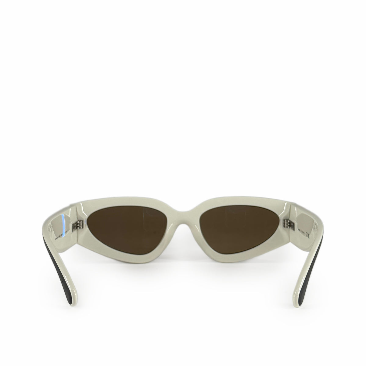 Cream-colored acetate cat-eye sunglasses with dark brown lenses, curated Pre-loved Luxury by Myluxe in Helsinki.