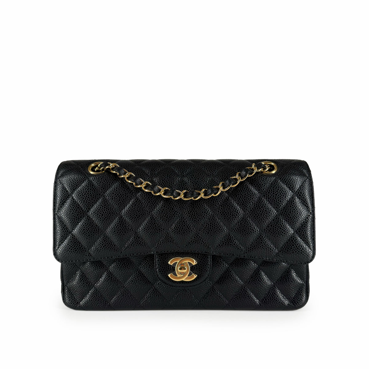 Black caviar leather quilted Chanel flap bag with gold-tone chain, curated Pre-loved Luxury by Myluxe in Helsinki.