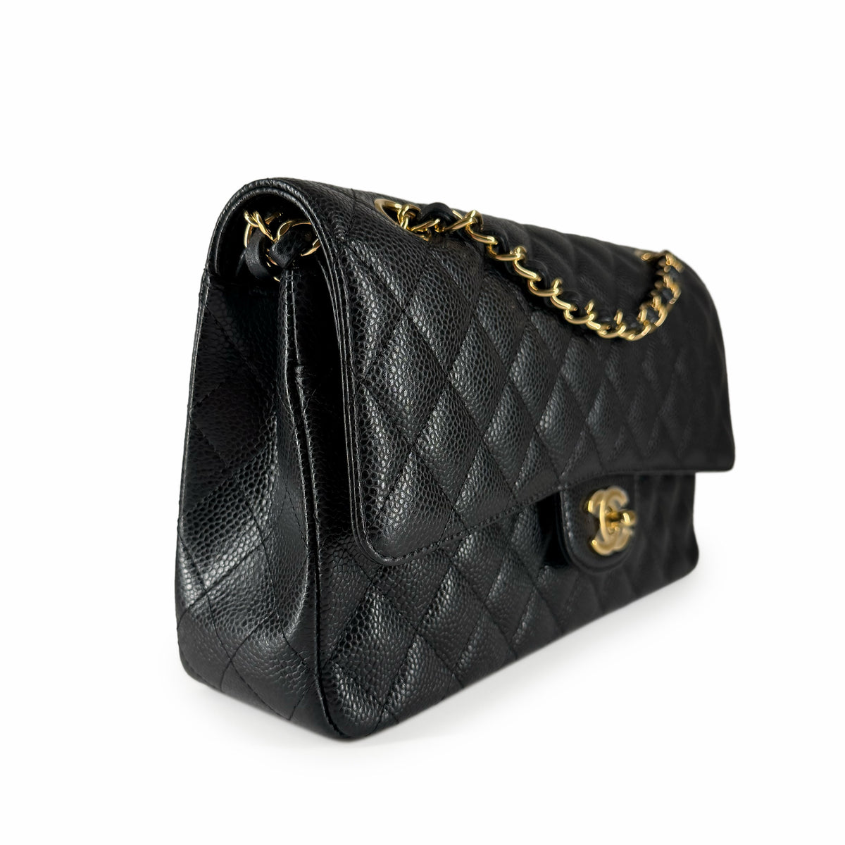 Black quilted caviar leather Chanel flap bag with gold chain strap, curated Pre-loved Luxury by Myluxe in Helsinki.
