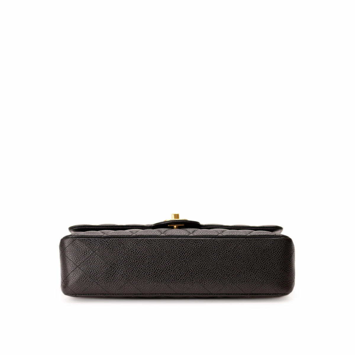 Black quilted caviar leather Chanel handbag with gold-tone clasp, curated Pre-loved Luxury by Myluxe in Helsinki.