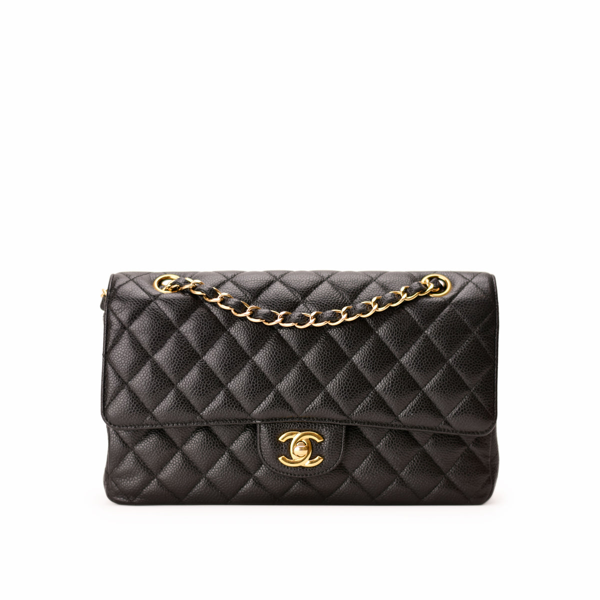 Black quilted leather Chanel shoulder bag with gold chain strap and logo, curated Pre-loved Luxury by Myluxe in Helsinki.
