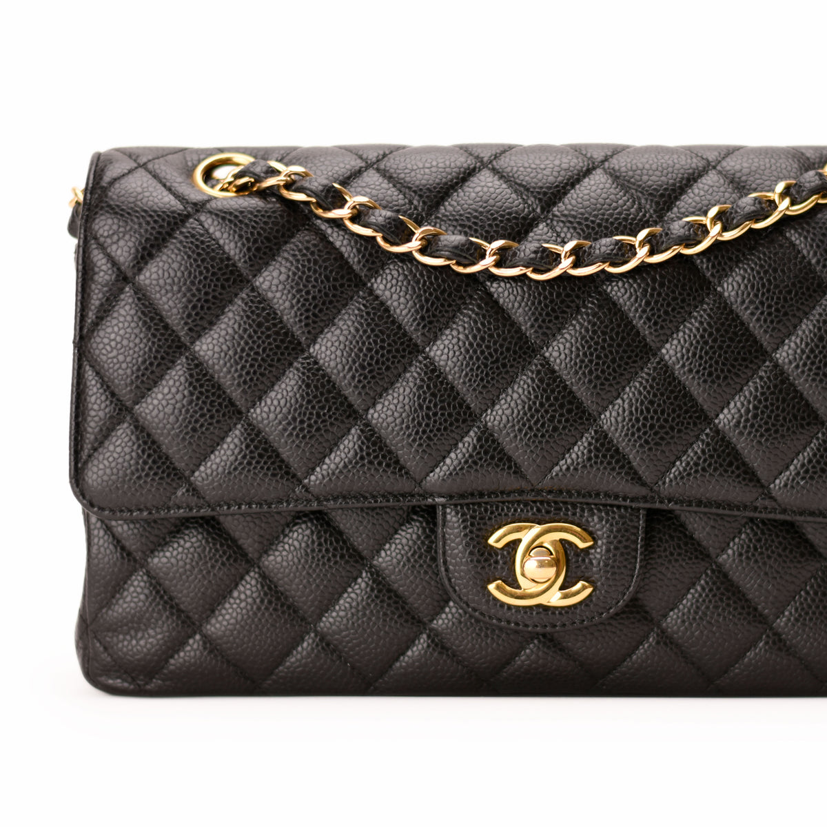 Black quilted leather Chanel handbag with gold chain strap and logo, curated Pre-loved Luxury by Myluxe in Helsinki.