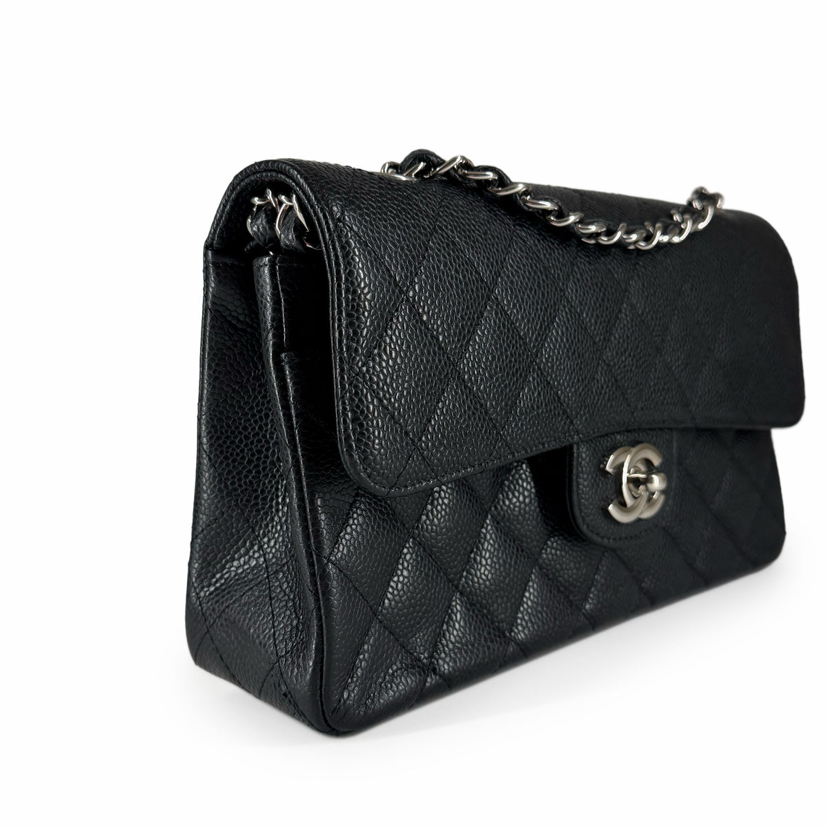Black quilted caviar leather Chanel flap bag with silver chain strap, curated Pre-loved Luxury by Myluxe in Helsinki.