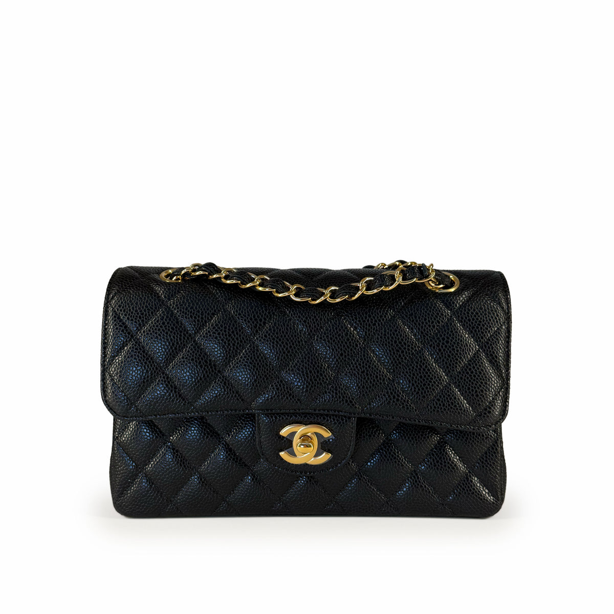 Black quilted leather Chanel flap bag with gold-tone chain strap, curated Pre-loved Luxury by Myluxe in Helsinki.