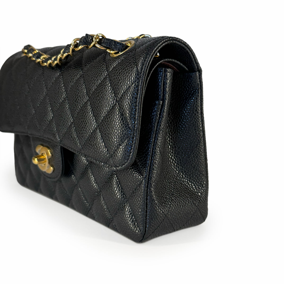 Black quilted caviar leather handbag with gold chain strap, curated Pre-loved Luxury by Myluxe in Helsinki.