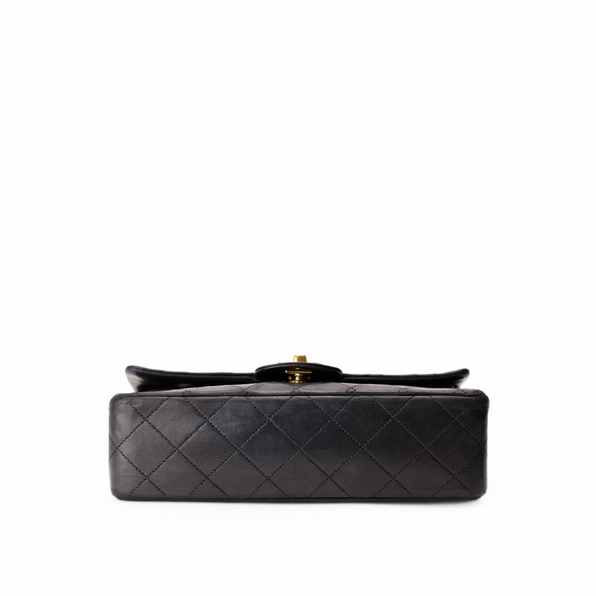 Black quilted leather Chanel handbag with gold-tone hardware, curated Pre-loved Luxury by Myluxe in Helsinki.