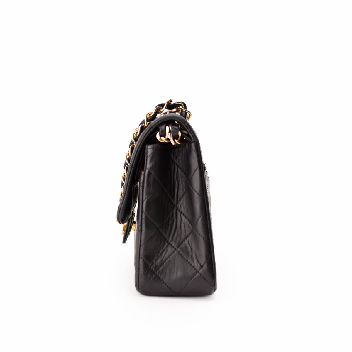 Black quilted leather Chanel handbag with gold-tone chain strap, curated Pre-loved Luxury by Myluxe in Helsinki.