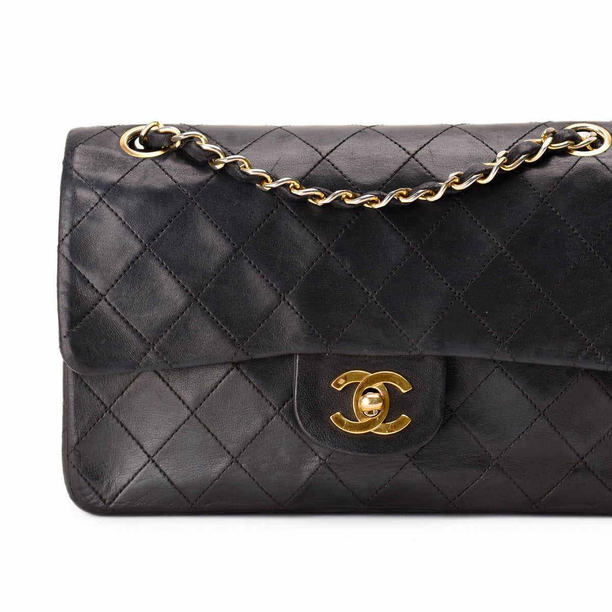 Black quilted leather Chanel shoulder bag with gold-tone chain and CC logo. curated Pre-loved Luxury by Myluxe in Helsinki.
