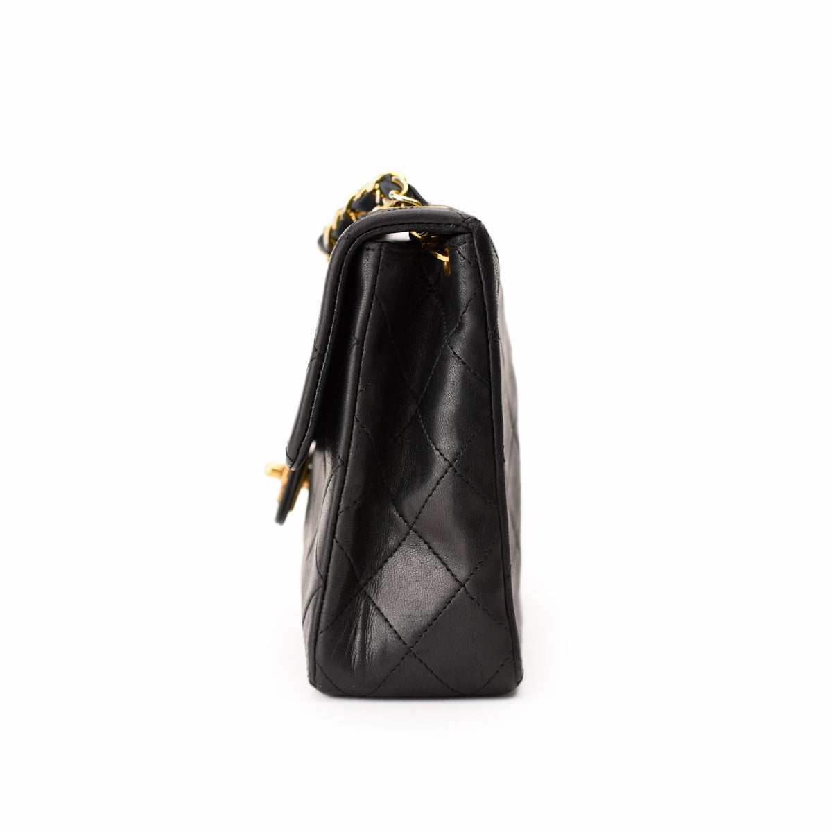 Black quilted leather Chanel handbag with gold chain strap, curated Pre-loved Luxury by Myluxe in Helsinki.