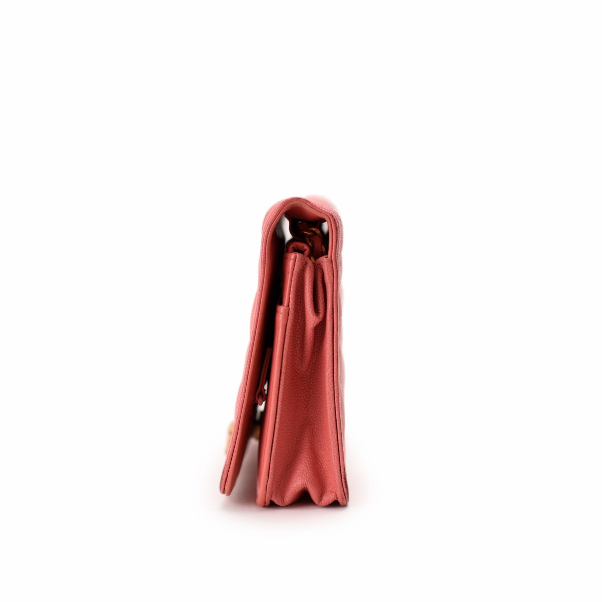Side view of a pink pebbled leather luxury handbag, curated Pre-loved Luxury by Myluxe in Helsinki.