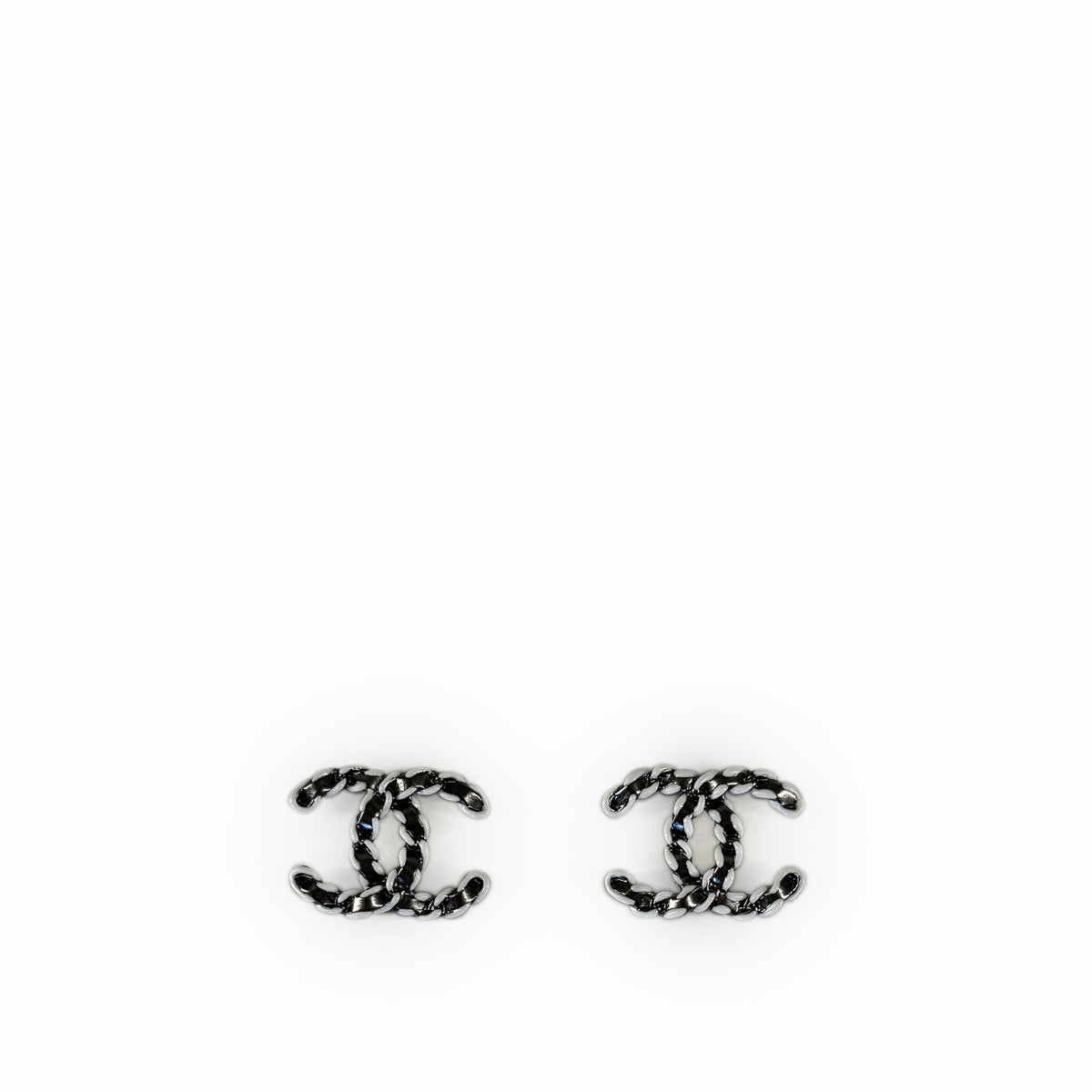 Silver-tone Chanel interlocking CC logo stud earrings, curated Pre-loved Luxury by Myluxe in Helsinki.