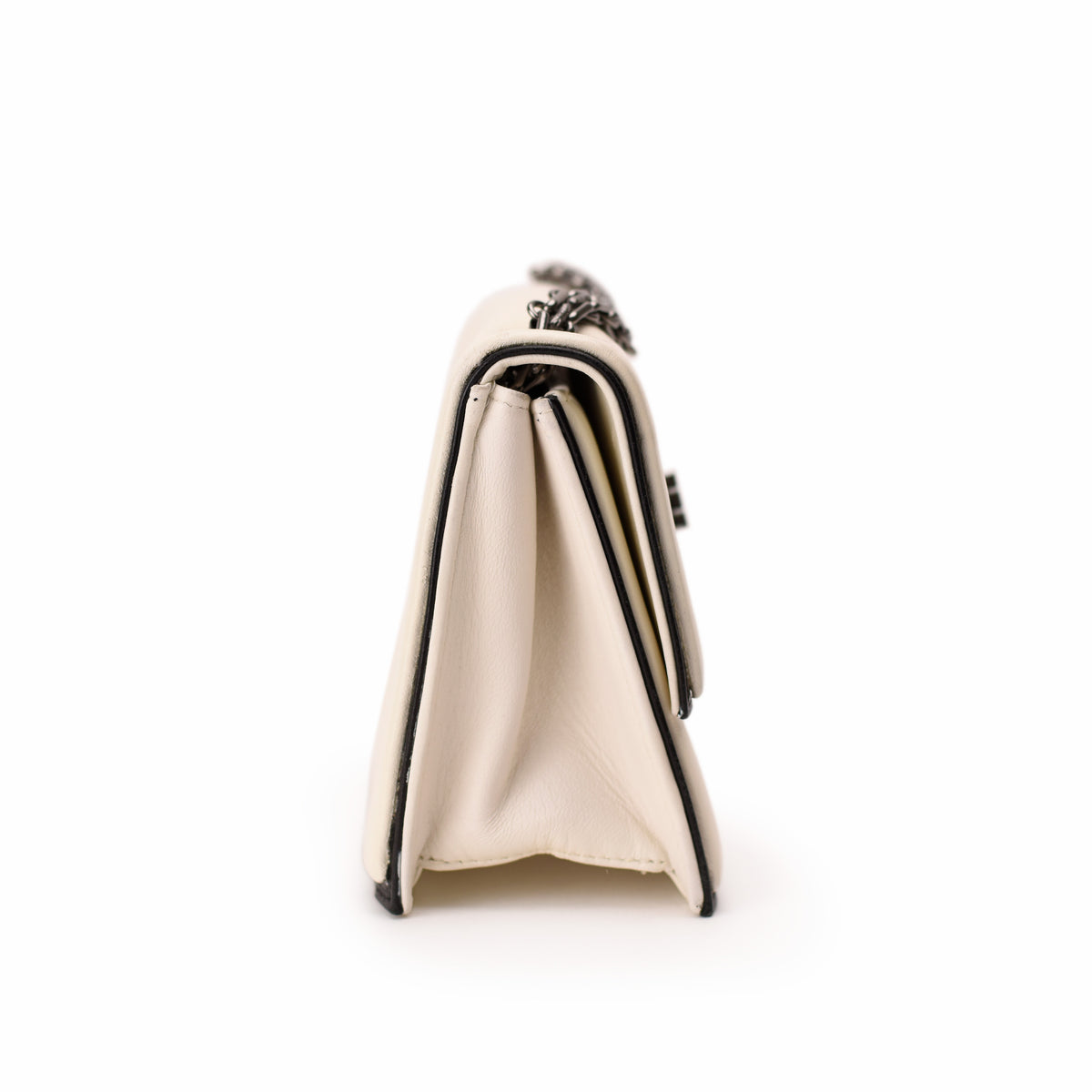 Cream leather Chanel flap bag with silver chain strap. curated Pre-loved Luxury by Myluxe in Helsinki.
