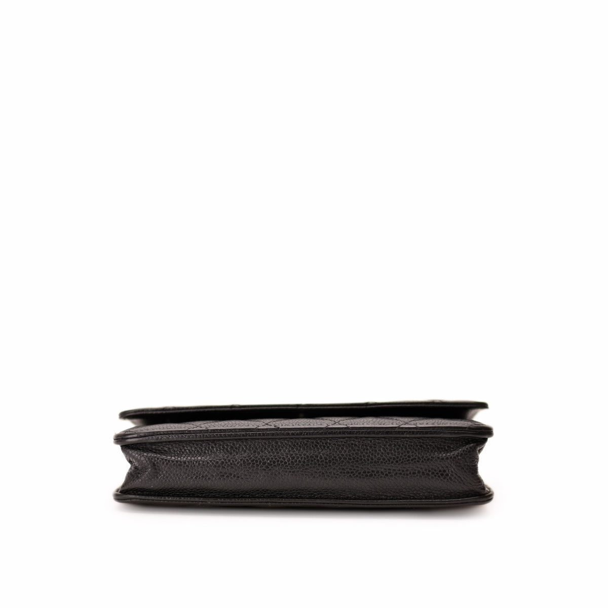 Side view of a black quilted leather Chanel wallet, curated Pre-loved Luxury by Myluxe in Helsinki.