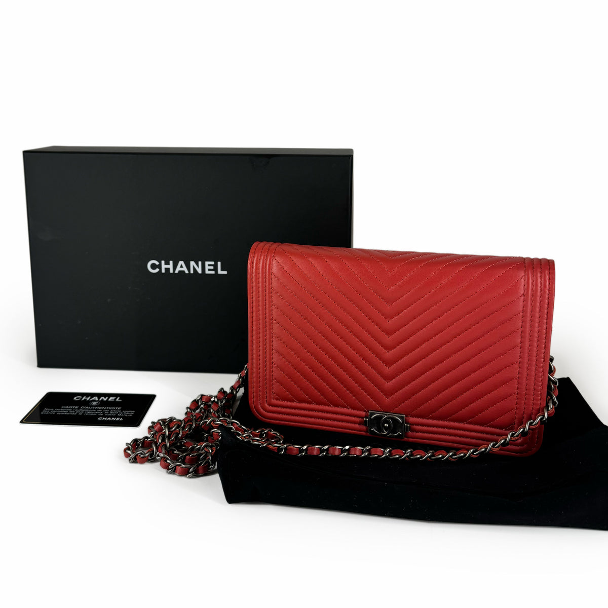 Red quilted leather Chanel flap bag with silver chain strap, curated Pre-loved Luxury by Myluxe in Helsinki.