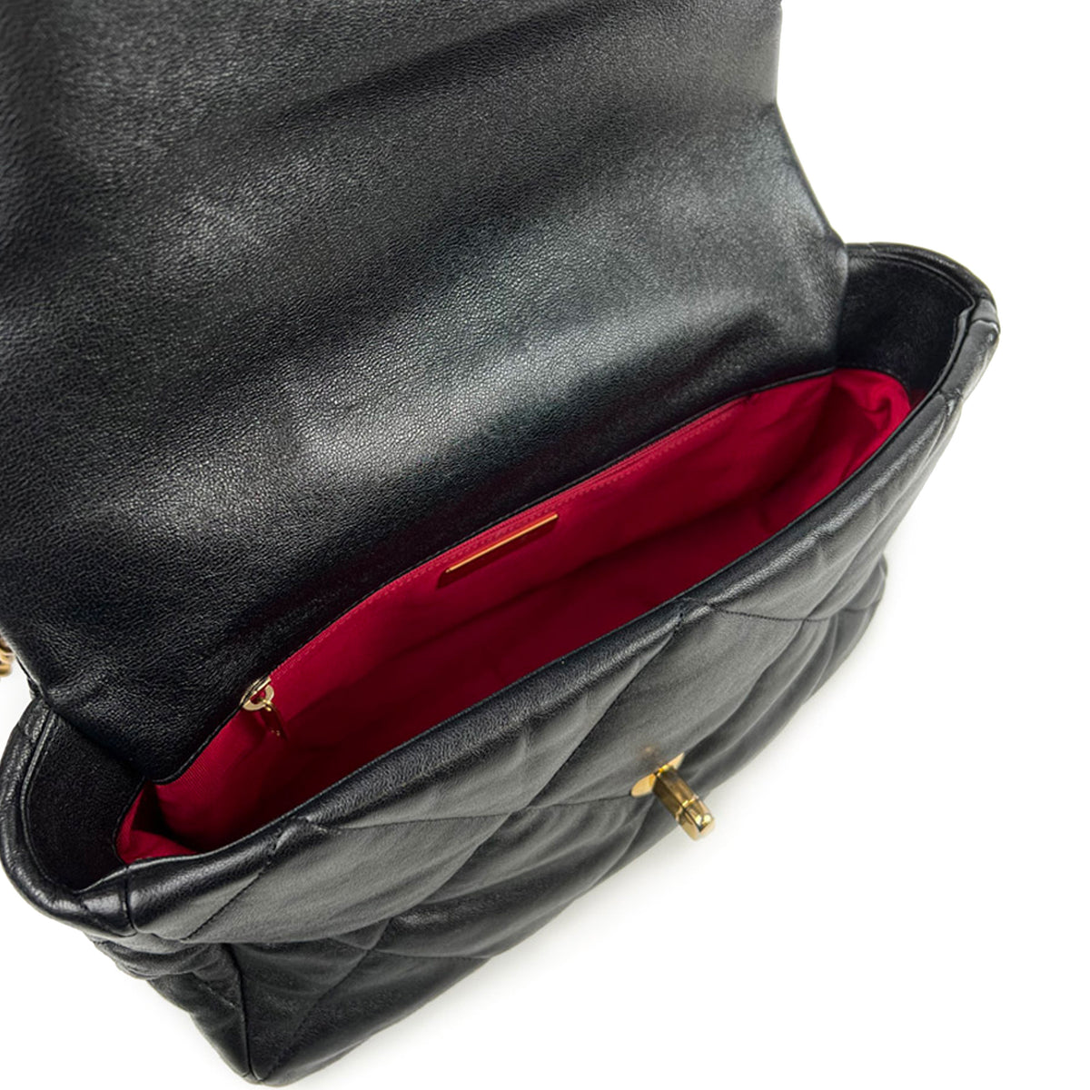 Black quilted leather handbag with red interior lining, curated Pre-loved Luxury by Myluxe in Helsinki.