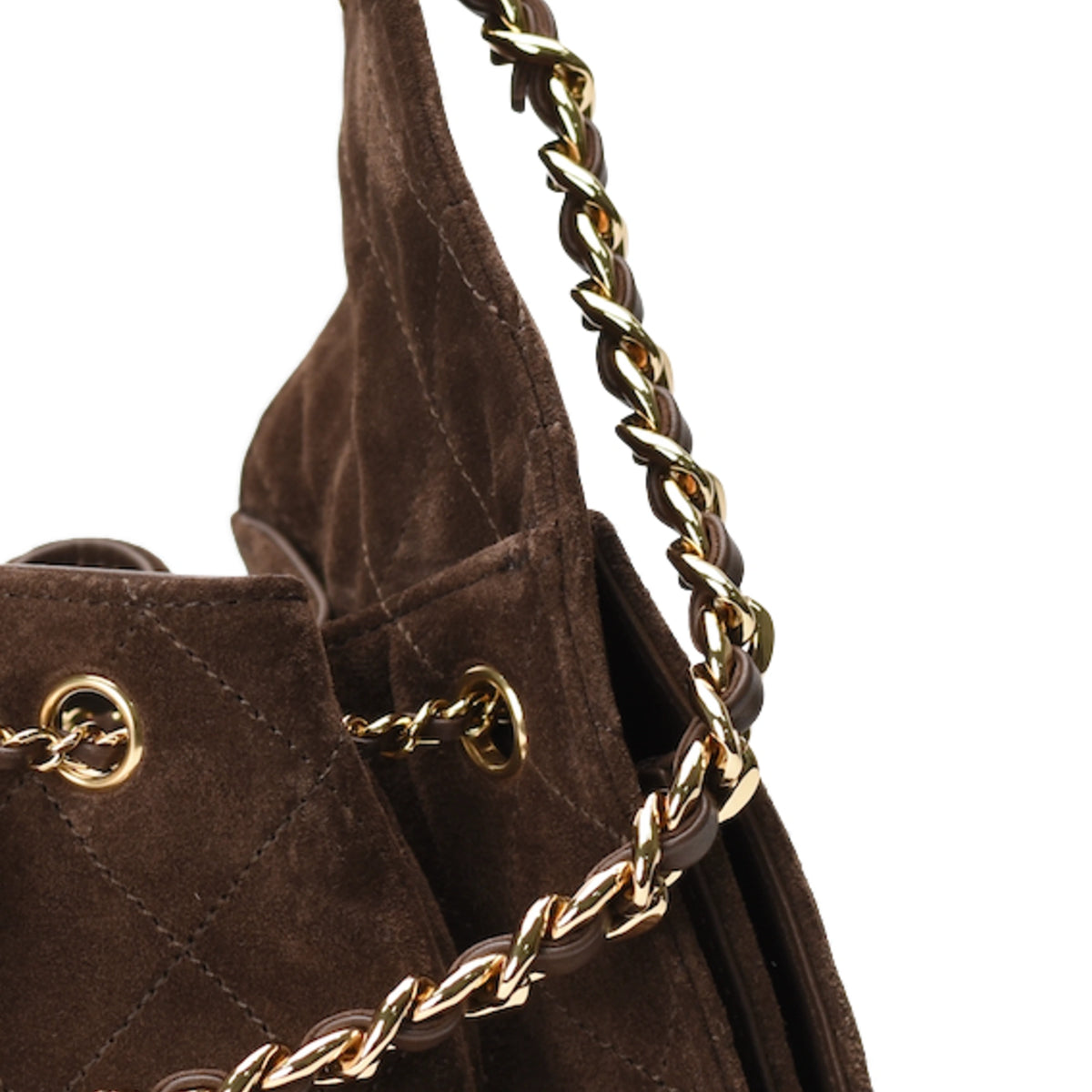 Close-up of brown suede Chanel bag with quilted stitching and gold chain strap. curated Pre-loved Luxury by Myluxe in Helsinki.