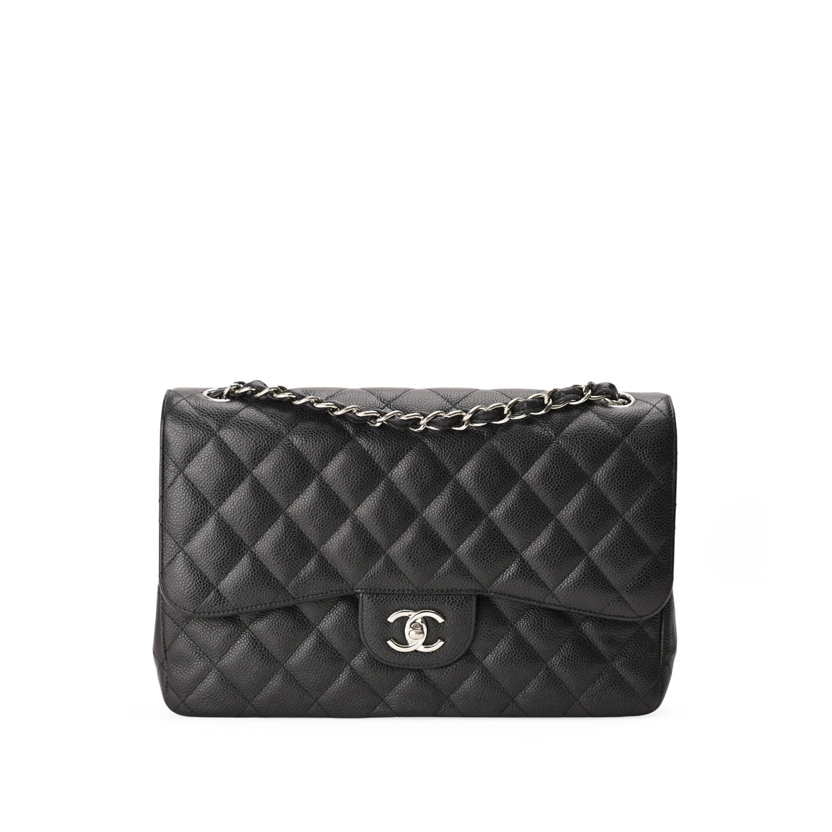 Chanel Timeless Jumbo black caviar leather quilted handbag with silver chain. curated Pre-loved Luxury by Myluxe in Helsinki.