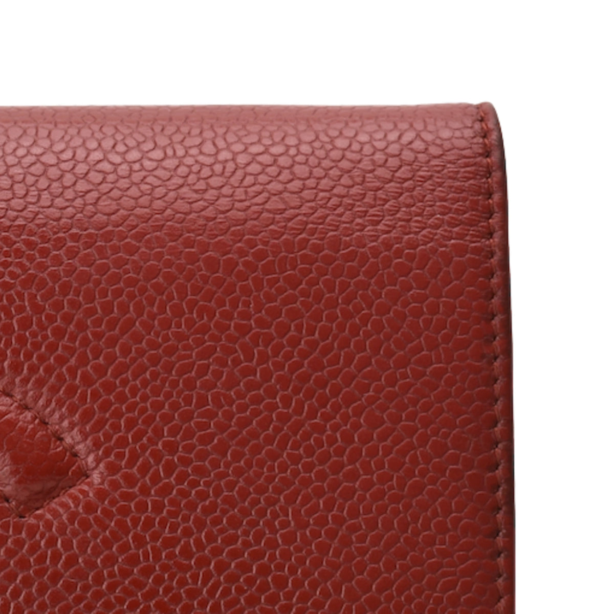 Chanel red caviar leather WOC texture. Curated Pre-loved Luxury by Myluxe in Helsinki.