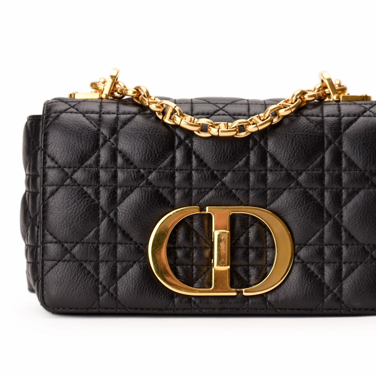 Black quilted leather Dior handbag with gold-tone CD logo and chain strap, curated Pre-loved Luxury by Myluxe in Helsinki.