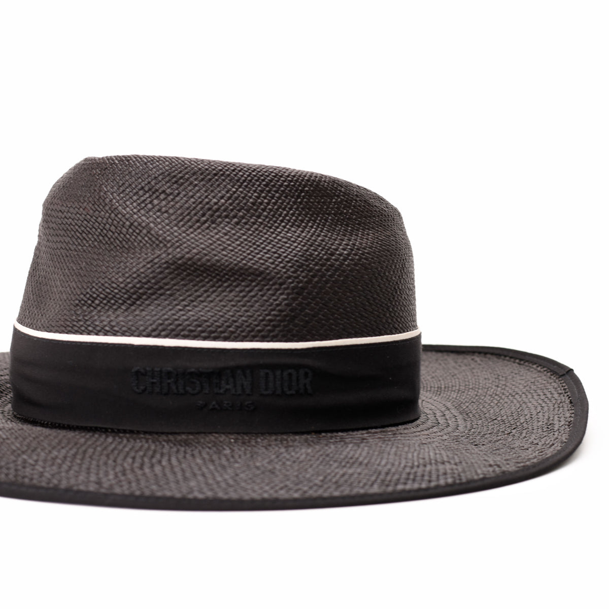 Black Christian Dior straw hat with branded band, curated Pre-loved Luxury by Myluxe in Helsinki.