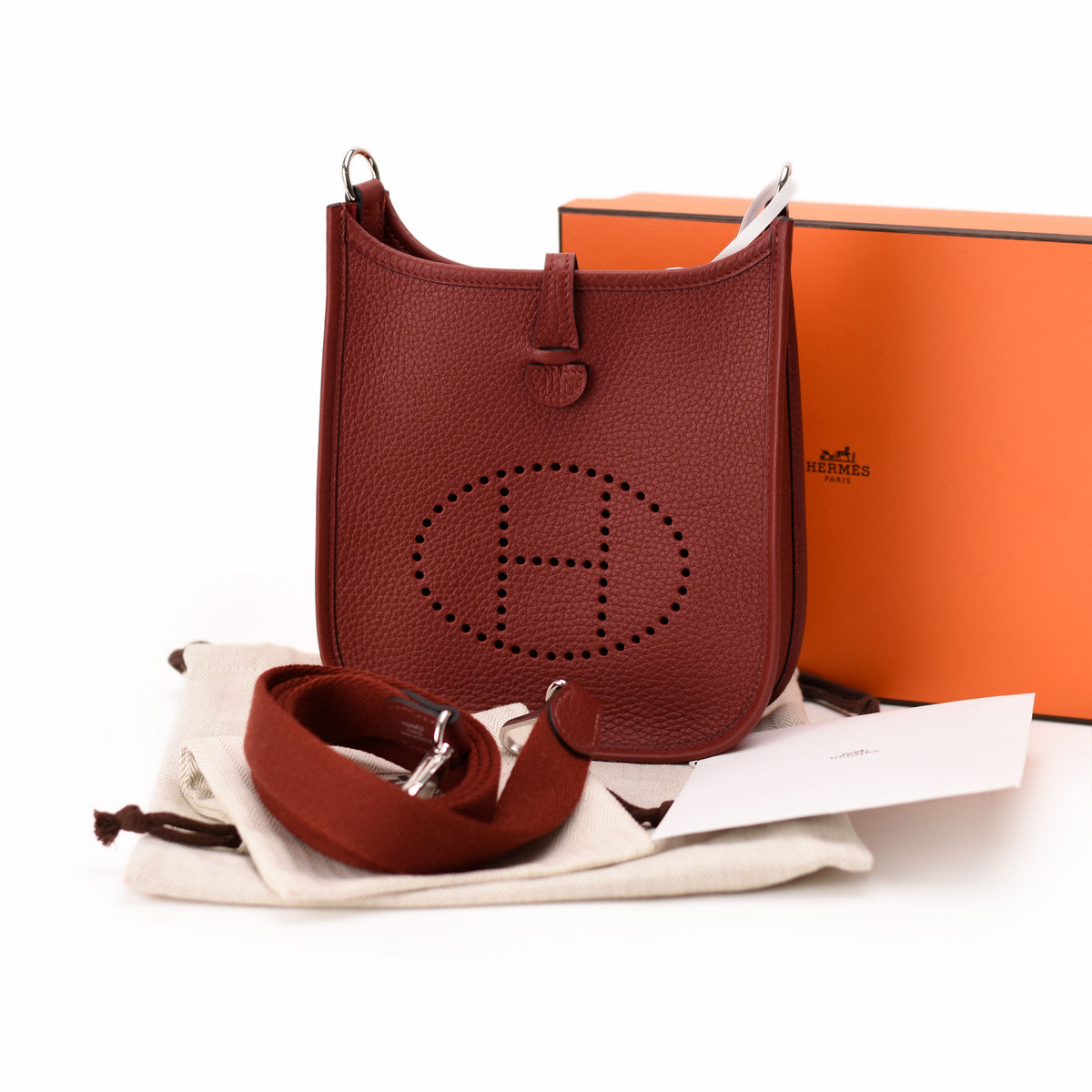 Hermès red leather bucket bag with perforated H logo. curated Pre-loved Luxury by Myluxe in Helsinki.