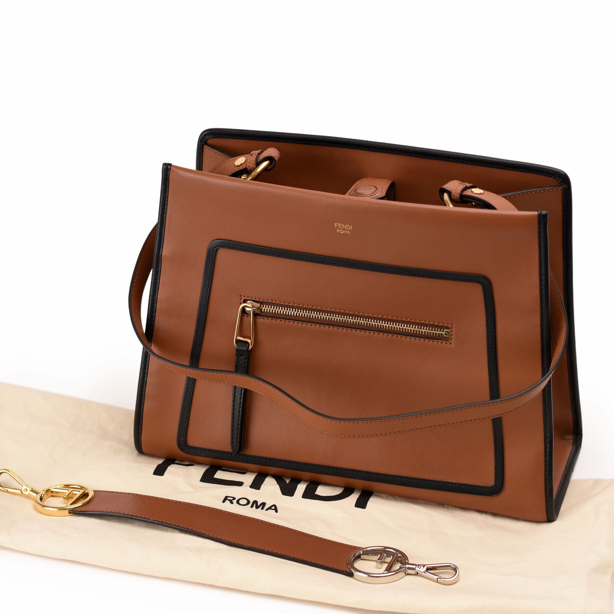 Tan leather Fendi Roma handbag with black trim and gold hardware. curated Pre-loved Luxury by Myluxe in Helsinki.