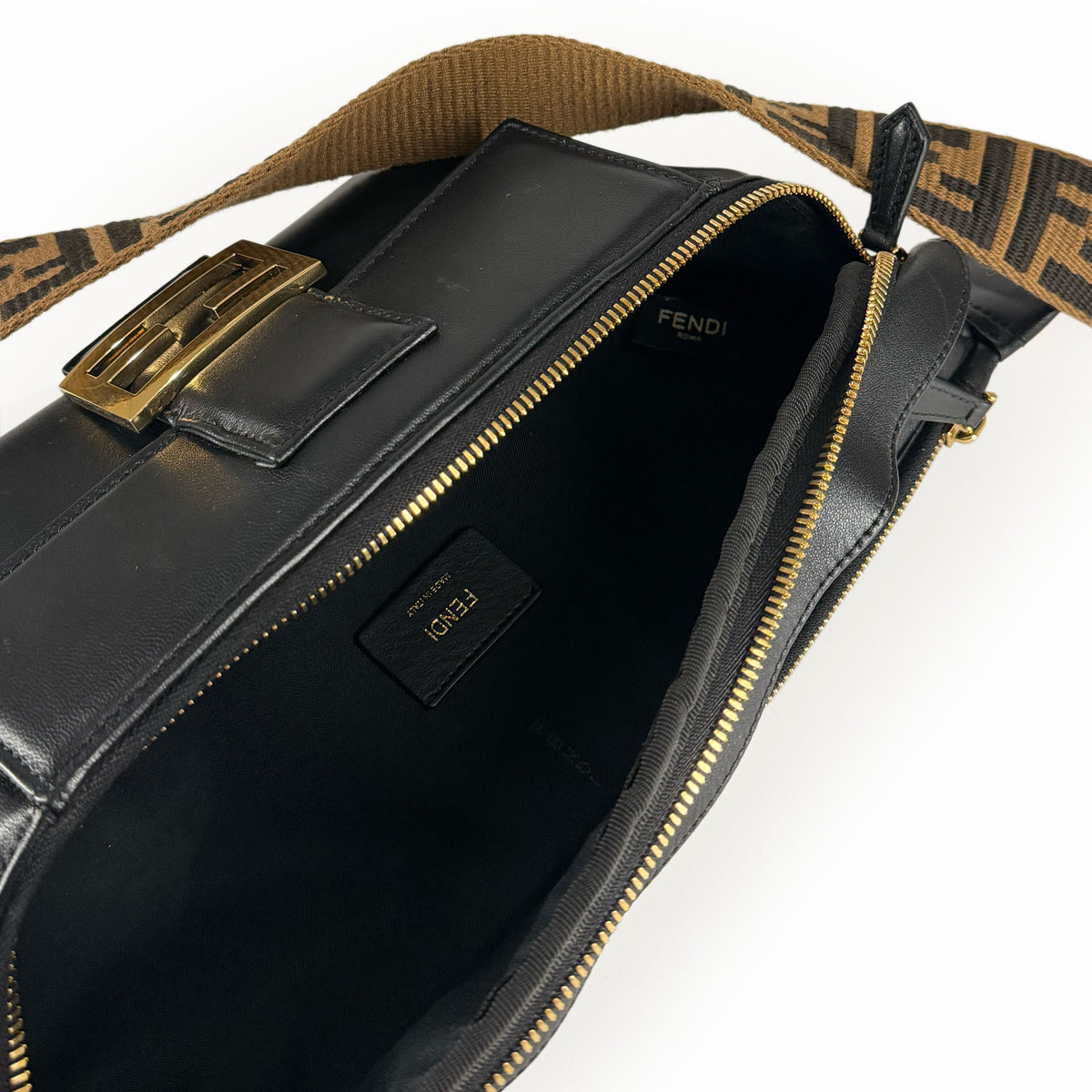 Black leather Fendi crossbody bag with gold hardware and brown FF monogram strap, curated Pre-loved Luxury by Myluxe in Helsinki.