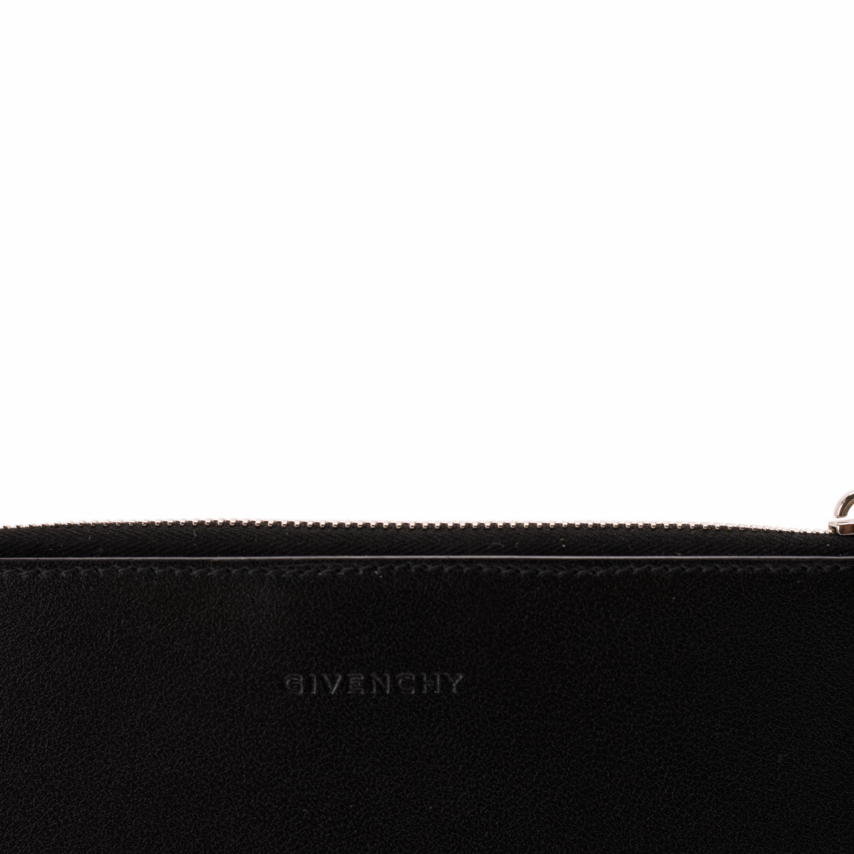 Black Givenchy suede clutch bag with subtle embossed logo, curated Pre-loved Luxury by Myluxe in Helsinki.