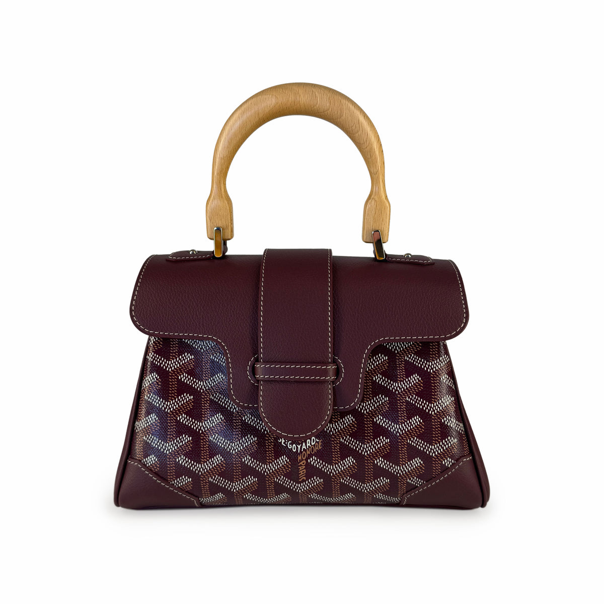 Burgundy Goyard patterned leather handbag with a wooden top handle, curated Pre-loved Luxury by Myluxe in Helsinki.