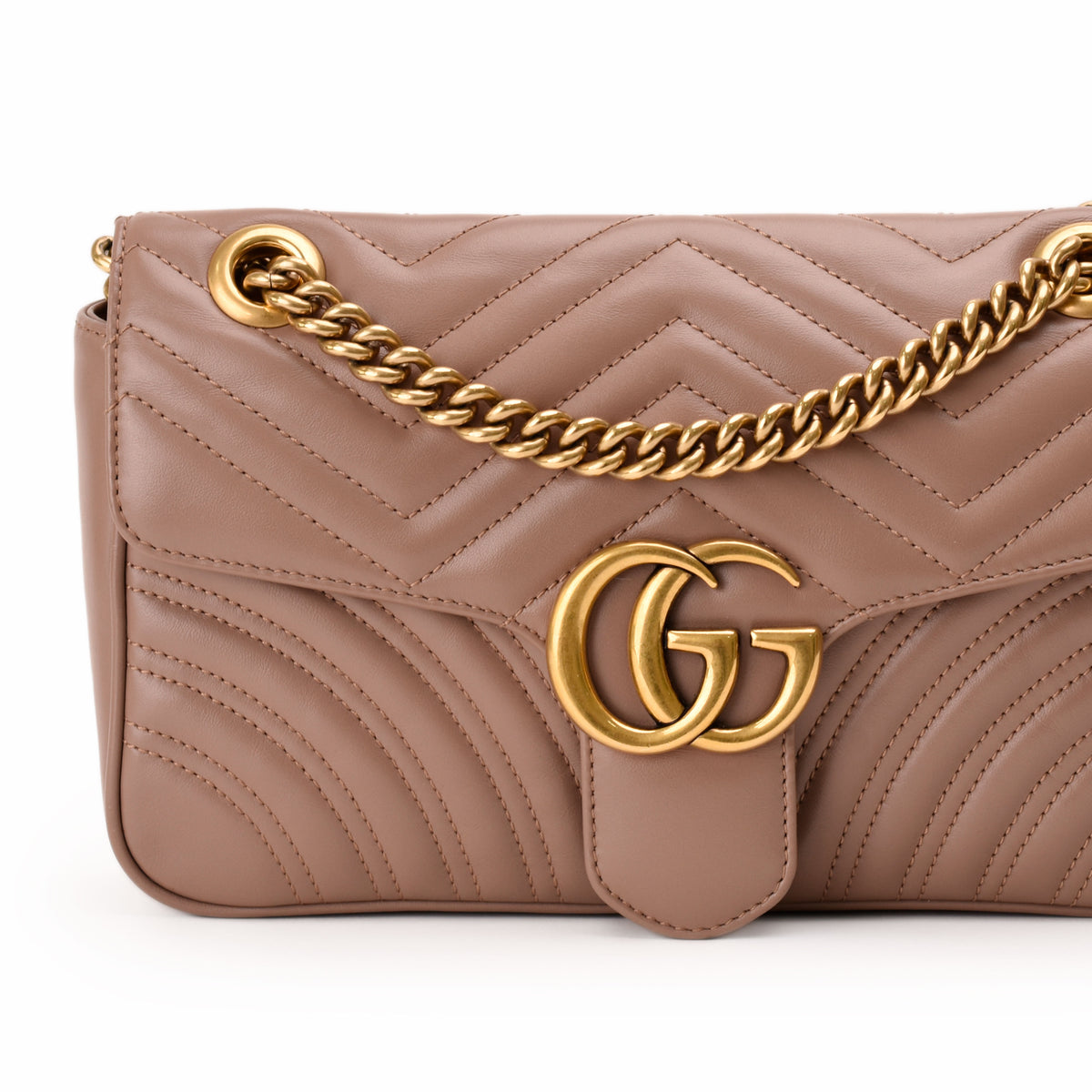Taupe quilted leather Gucci bag with gold chain and GG logo. curated Pre-loved Luxury by Myluxe in Helsinki.