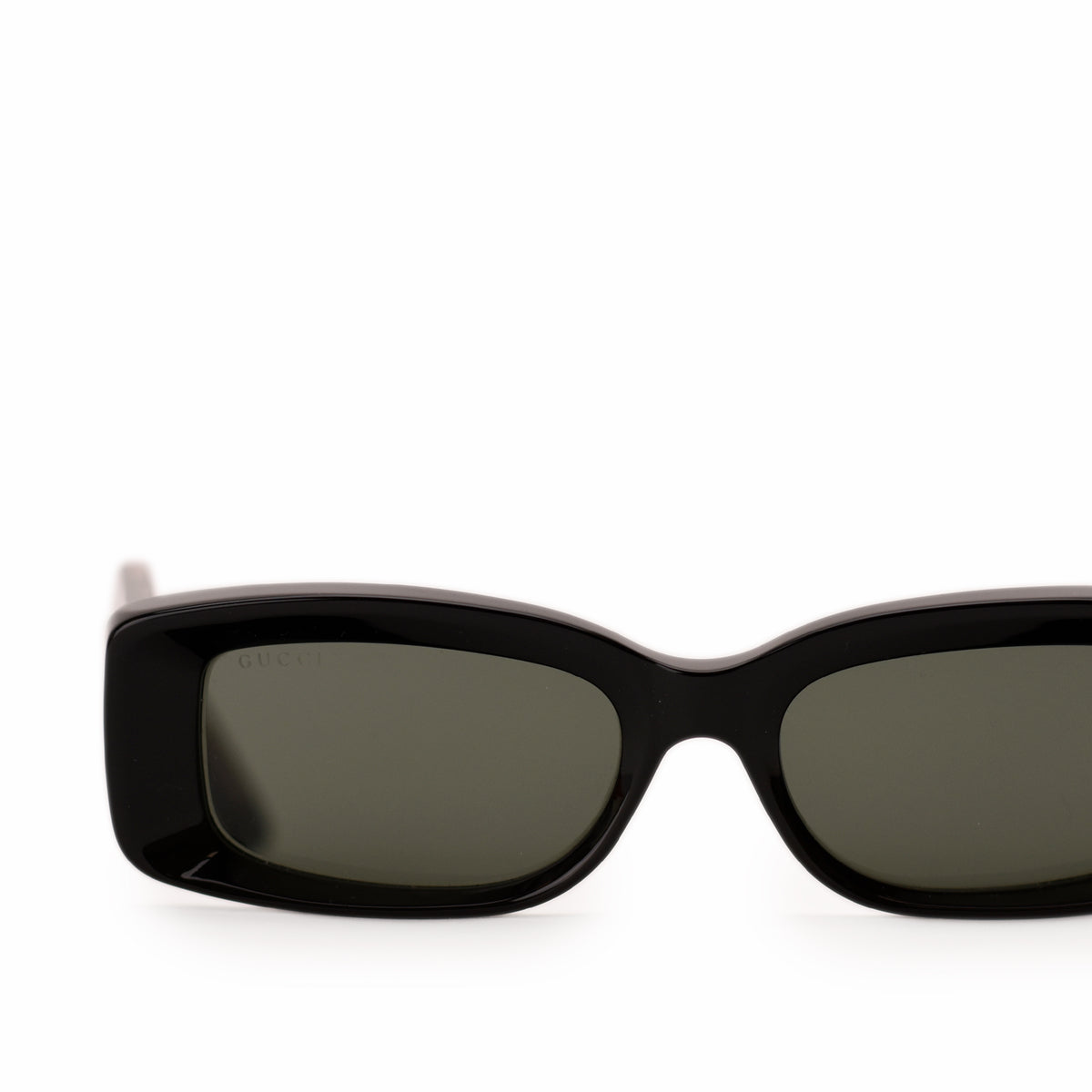 Black Gucci rectangular sunglasses with dark tinted lenses. curated Pre-loved Luxury by Myluxe in Helsinki.