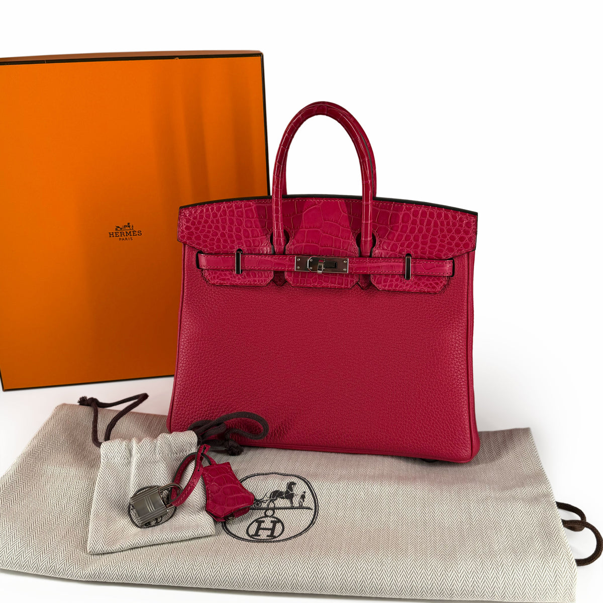 Hermès Birkin 25 bag in Framboise Touch leather with PHW hardware, featuring structured design and top handle for luxury style.