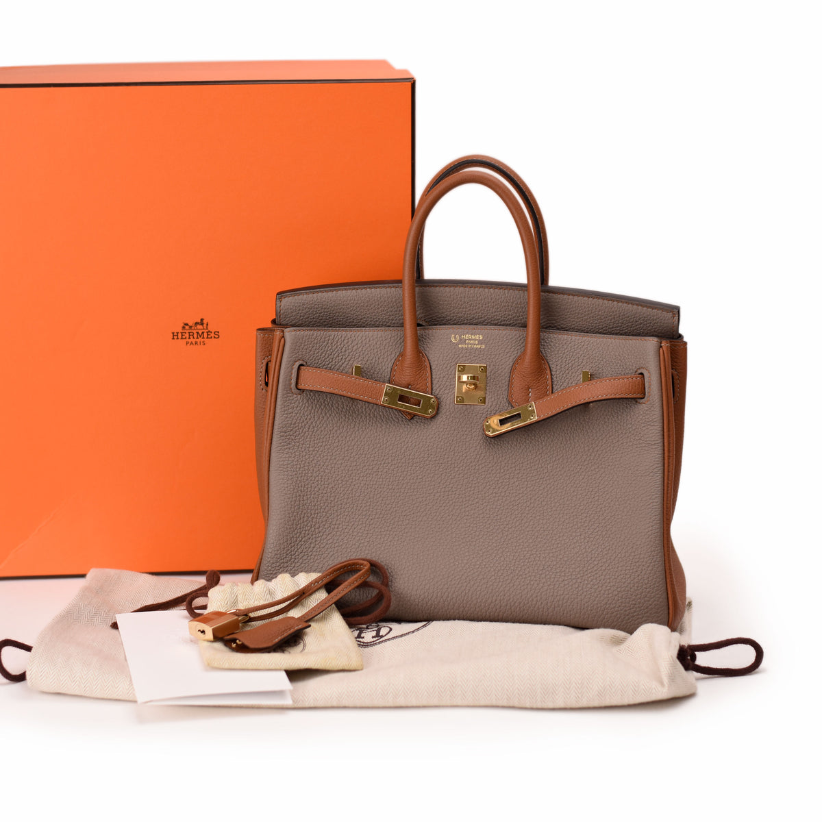 Taupe grained leather Hermès Birkin bag with brown straps and gold hardware, curated Pre-loved Luxury by Myluxe in Helsinki.