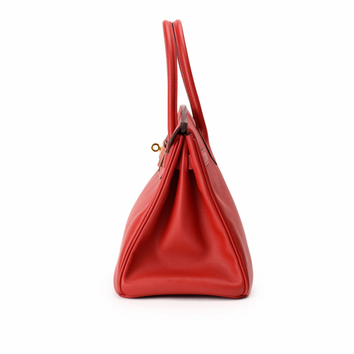 Red pebbled leather designer handbag with top handles. curated Pre-loved Luxury by Myluxe in Helsinki.