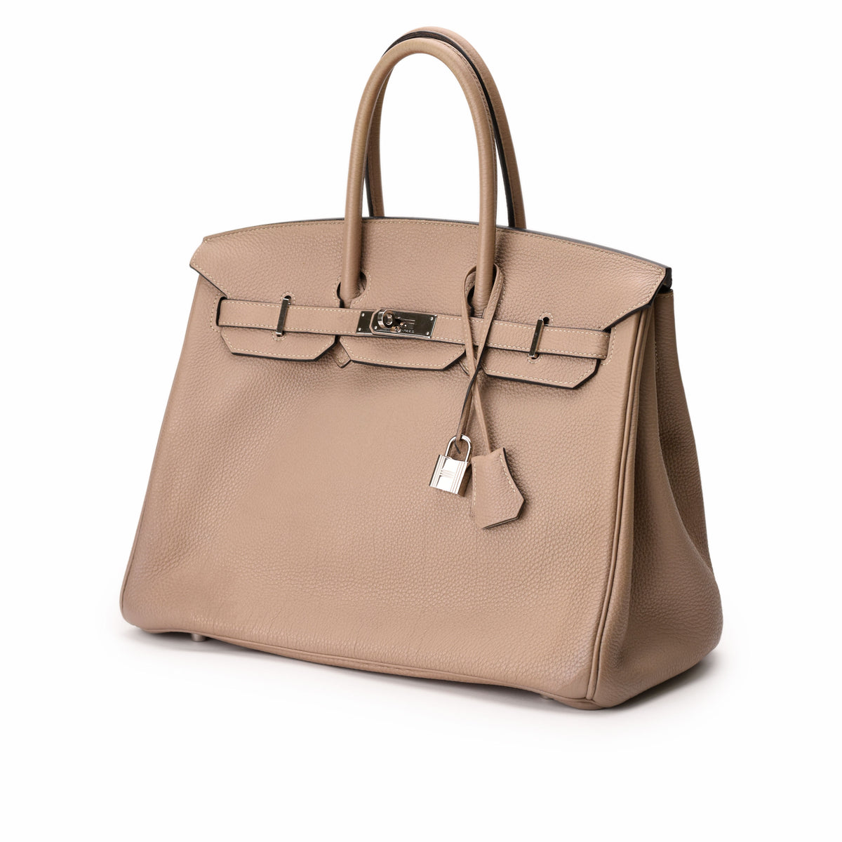 Hermès Birkin handbag in beige grained leather with silver hardware. curated Pre-loved Luxury by Myluxe in Helsinki.