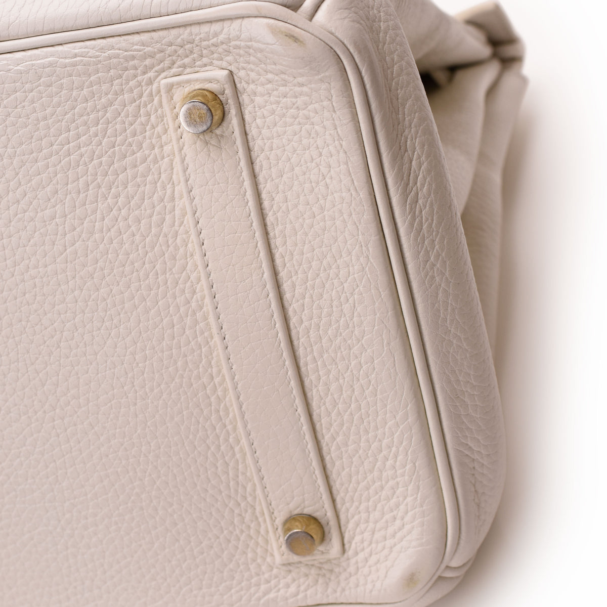 Cream pebbled leather luxury handbag with gold-tone hardware, curated Pre-loved Luxury by Myluxe in Helsinki.